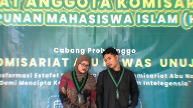 Silfia Dera Wulandari (Kiri) dan Taufiqurrohman, S. E. (Kanan) selaku Ketua Umum dan Sekretaris Umum HMI Komisariat Abu Nawas UNUJA Periode 2024-2025 di RAK ke- IX (MimbarFoto/Abdy)